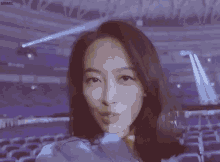 a close up of a woman making a funny face with her mouth open