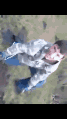 a person is flying through the air with a blurred background