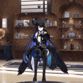 a girl with wings is sitting in front of a shelf with a picture of a man on it