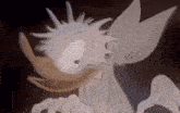 a close up of a cartoon character 's face with a strange expression
