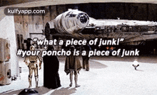 a group of people standing in front of a star wars falcon .