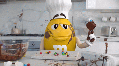 M And Ms Yellow GIF - M And Ms Yellow Baking GIFs