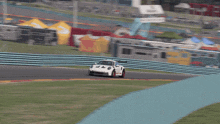a white race car with the number 47 on the front