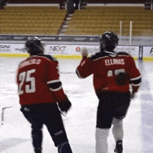a hockey player in a red jersey with the number 25 on it