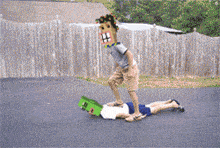a pixelated image of a man with a green box on his head