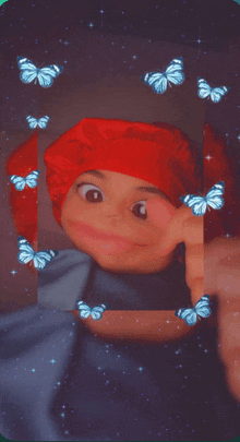 a girl wearing a red hat is surrounded by butterflies