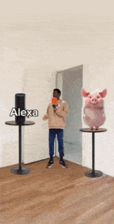 a man holding a megaphone standing next to a pink pig that says it 's a
