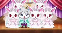 a group of white rabbits are standing next to each other and one has a crown on its head