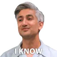 a man with his eyes closed is smiling and says i know