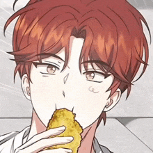 a man with red hair is eating a fried food item .