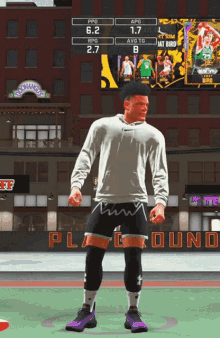 a basketball player is standing in front of a scoreboard that says playground