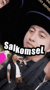 a man drinking from a bottle with salkomsel written on the bottom