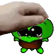 a hand is petting a green cartoon character with sunglasses on .