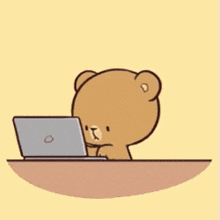 a couple of teddy bears are hugging each other while sitting on a table .