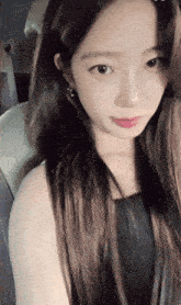 a close up of a woman 's face with a blurred background