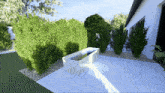 a white planter with flowers in it sits on a white patio