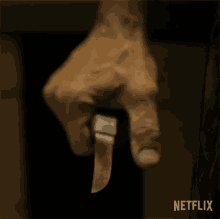 Gripping Knife Guillermo Del Toros Cabinet Of Curiosities GIF - Gripping Knife Guillermo Del Toros Cabinet Of Curiosities Clutching Knife GIFs