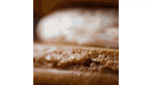 a close up of a piece of bread that looks like a hamburger