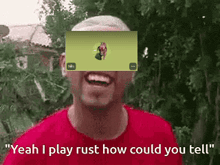 a man in a red shirt says " yeah i play rust how could you tell " in front of a screen