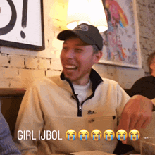 a man wearing a hat is laughing with the words girl ijbol behind him