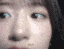 a close up of a woman 's face with the words he 's on written on the bottom .