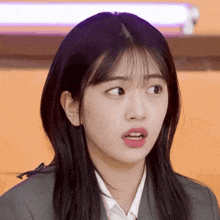 a close up of a woman making a funny face with her mouth open