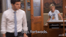 a man in a white shirt and blue tie says sup fartwads