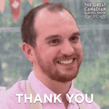 a man with a beard is smiling with the words thank you behind him