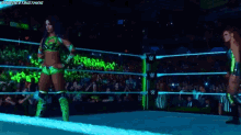 two women wrestling in a ring with the words " the next big thing " written on the bottom
