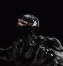 a black and white image of a person 's face being sprayed with water