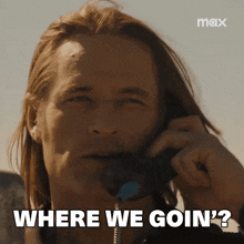 a man talking on a phone with the words where we goin '