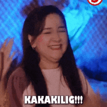 a woman is smiling with the words kakakilig !!! written on her face