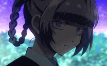 a close up of a girl 's face with a braid