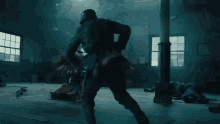 a woman in a wonder woman costume is fighting a man