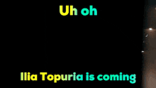 a person in a red jacket with the words uh oh ilia topuria is coming