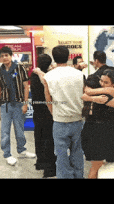 people hugging in front of a sign that says " select your heroes "