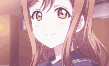a close up of a girl 's face with a sailor uniform on