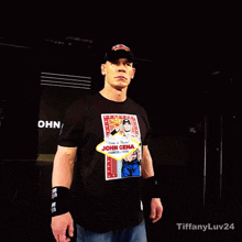 a man wearing a black shirt that says john cena on it