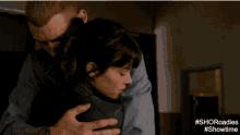 a close up of a man and woman kissing with the hashtag showtime on the bottom