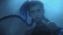 a woman with braids is standing in the water looking at something .