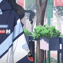 a person wearing a jacket that says kitakata on the sleeve