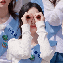 a woman wearing a sash that says ' seoul ' on it