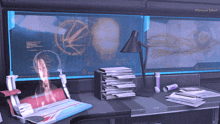 a desk with a stack of magazines on it and a computer monitor that says illustrate soul