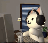 a cat wearing headphones is sitting in front of a computer monitor