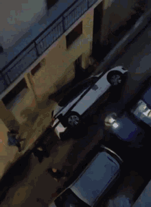 a police car is parked on the side of the road at night
