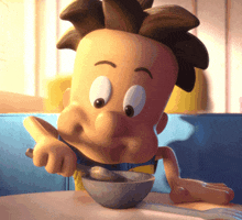 a cartoon character is eating from a bowl with a fork