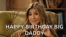a woman is sitting in a chair and making a funny face while saying `` happy birthday big daddy '' .