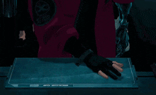 a person with a robotic arm is playing a video game on a screen that says seeds of
