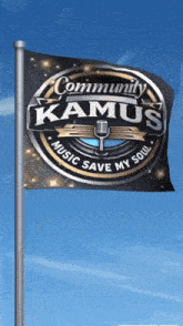 a flag that says community kamus music save my soul is flying in the wind