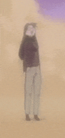 a blurred image of a person standing in a desert .